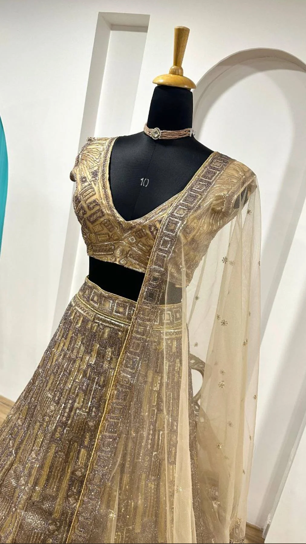 Golden Elegance – Embroidered Net Lehenga Choli with Dupatta