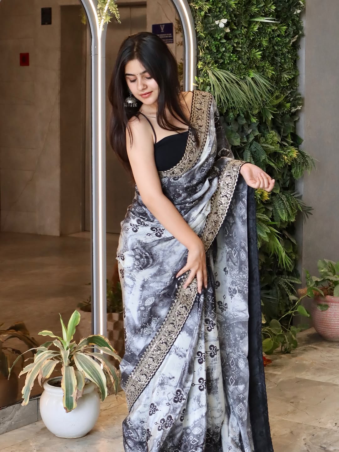 Elegant Black and White Saree with Intricate Lace Border