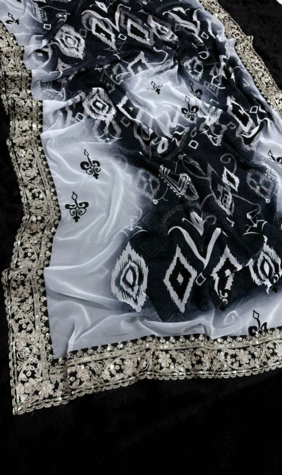 Elegant Black and White Saree with Intricate Lace Border