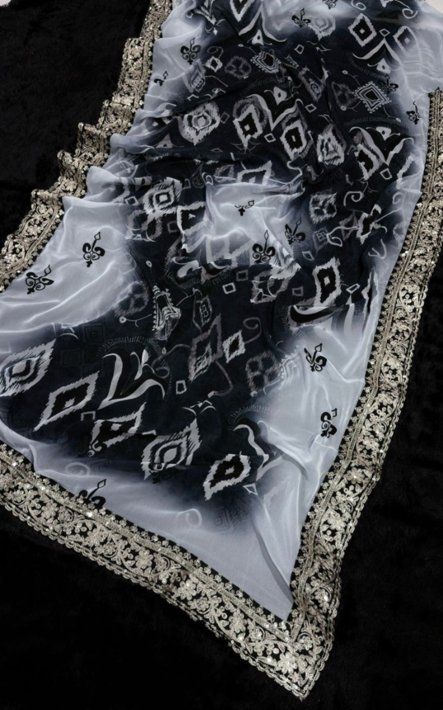 Elegant Black and White Saree with Intricate Lace Border