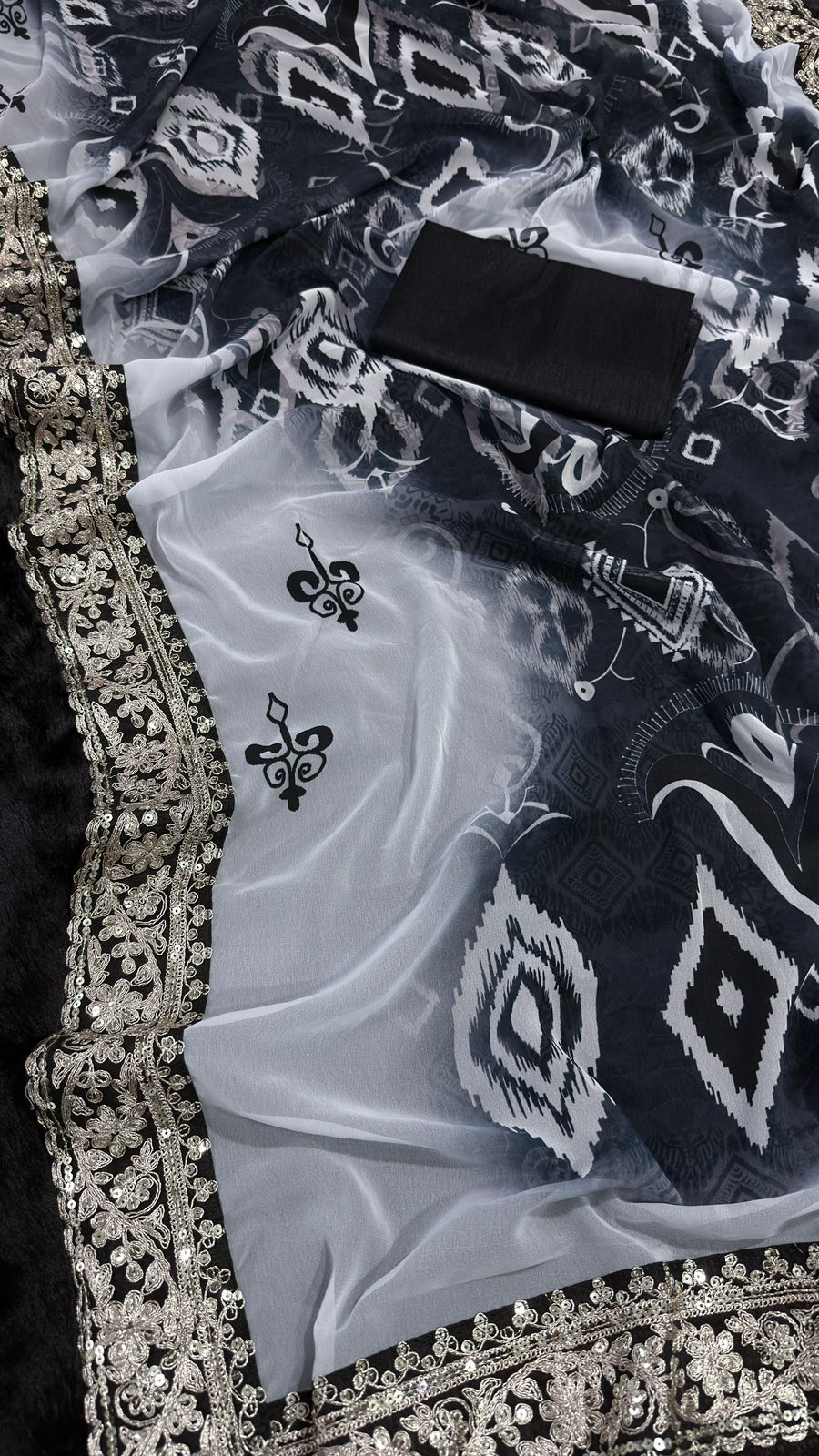 Elegant Black and White Saree with Intricate Lace Border