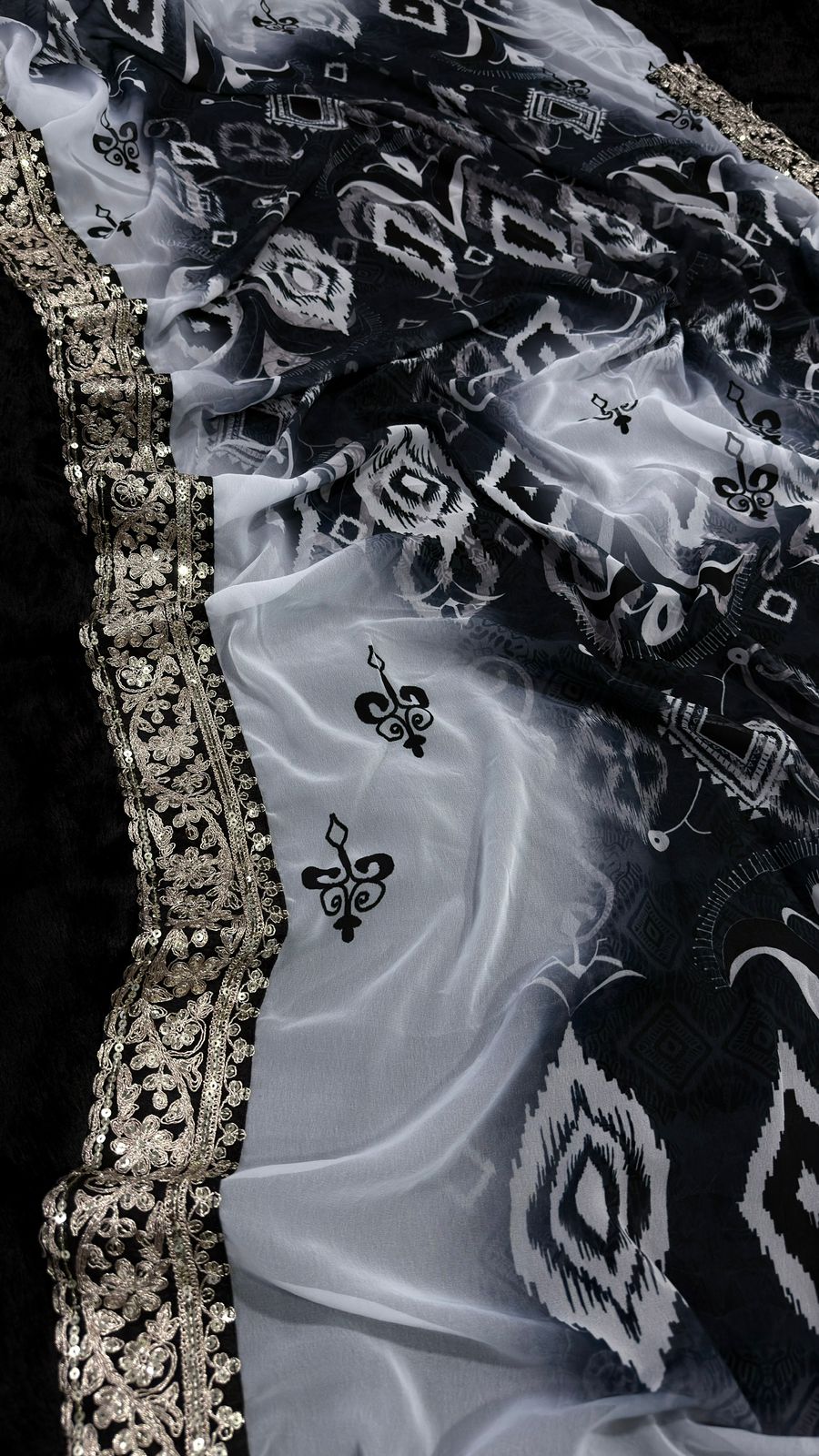 Elegant Black and White Saree with Intricate Lace Border