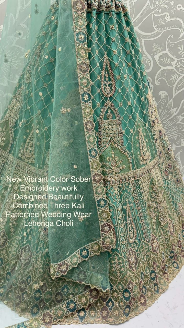 New Vibrant Wedding Wear Net Lehenga Choli with Peacock Embroidery, Zari & Diamond Work – Three Kali Pattern | Elegant Reception Ensemble