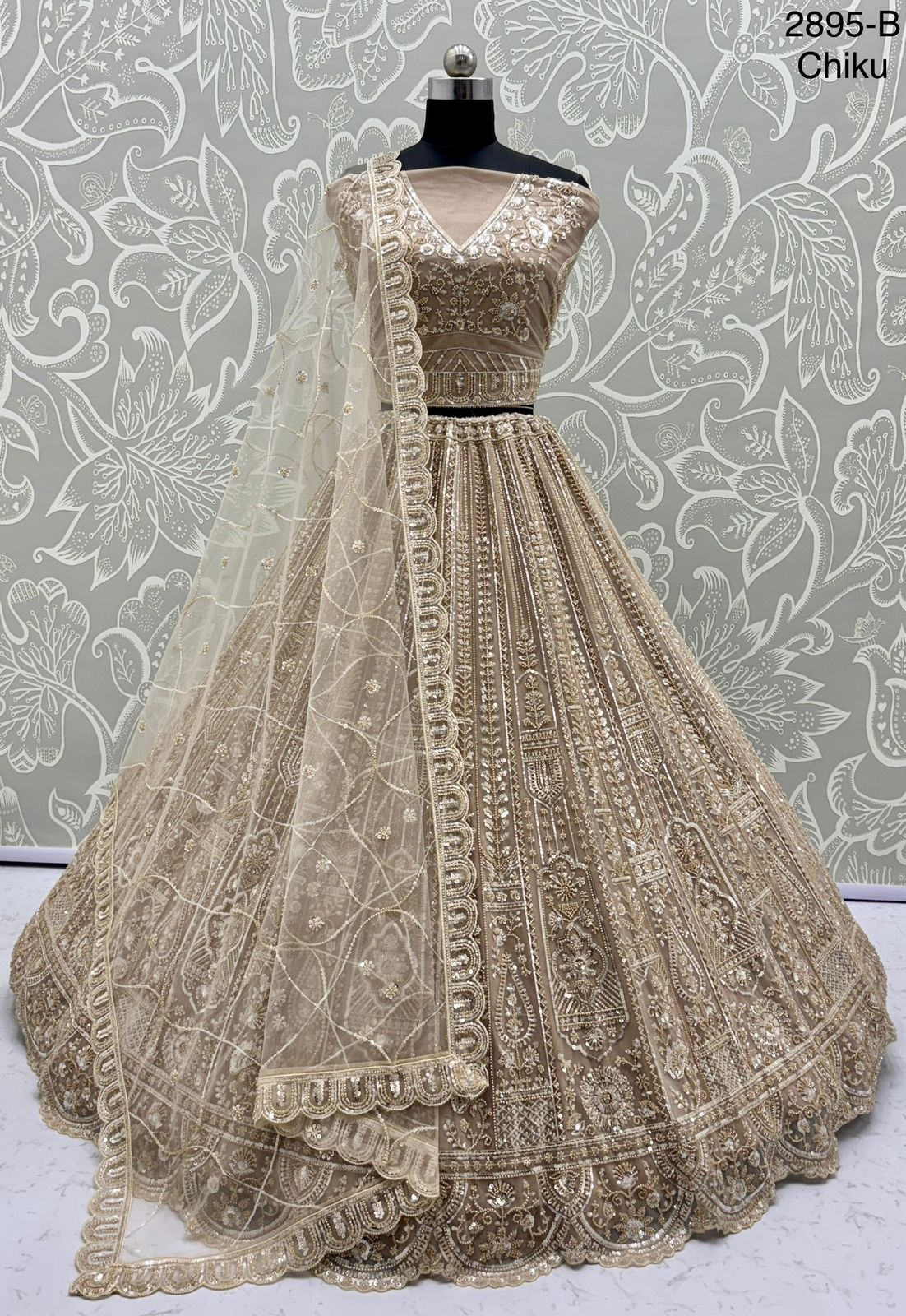 Exquisite Handwork Net Lehenga Choli – Motif, Sequin & Thread Embroidery