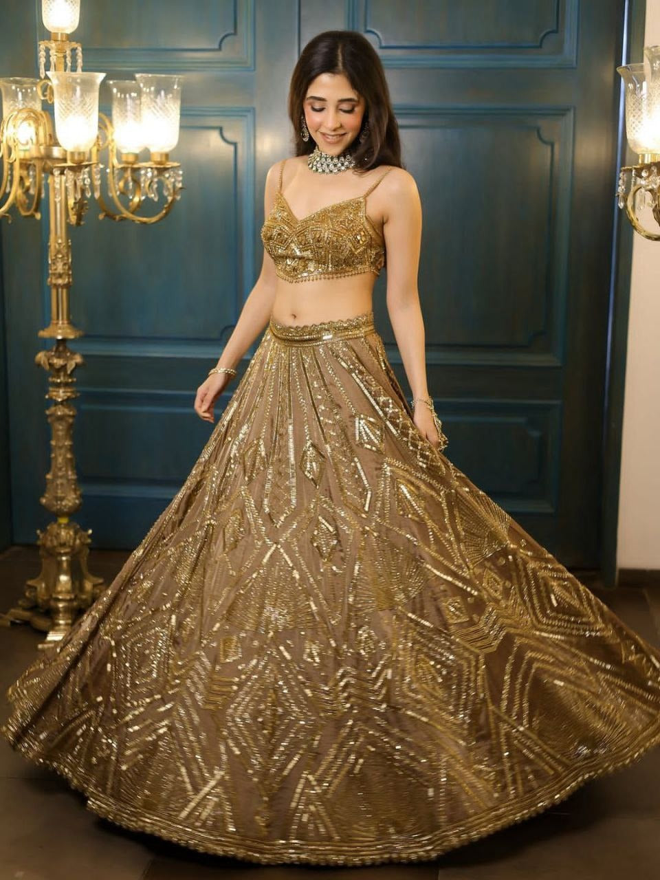 Regal Gold Embroidered Lehenga Set with Handcrafted Detailing & Net Dupatta