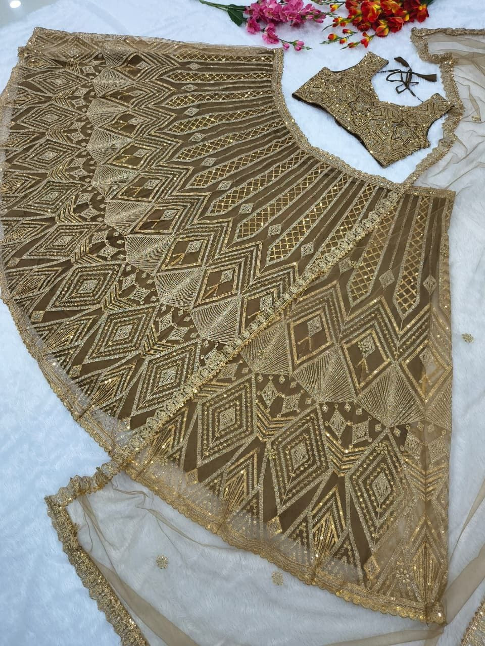 Regal Gold Embroidered Lehenga Set with Handcrafted Detailing & Net Dupatta