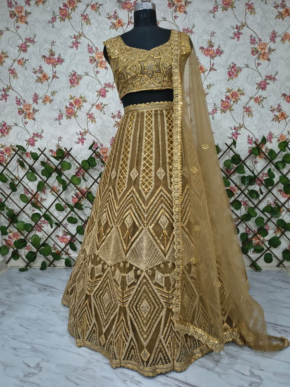 Regal Gold Embroidered Lehenga Set with Handcrafted Detailing & Net Dupatta